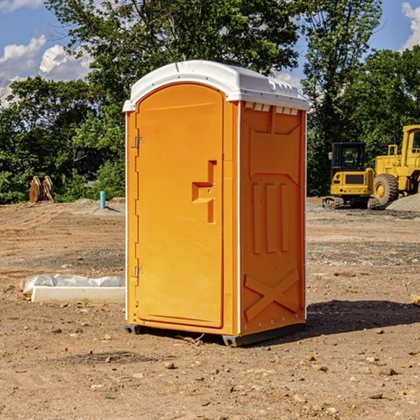 what is the cost difference between standard and deluxe portable restroom rentals in Adair County Iowa